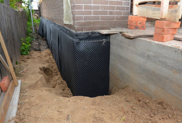 Happy homeowners after waterproofing job in Bradyville